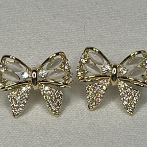New  bow shape, feminine earrings in gold with clear stones, dainty, sparkling